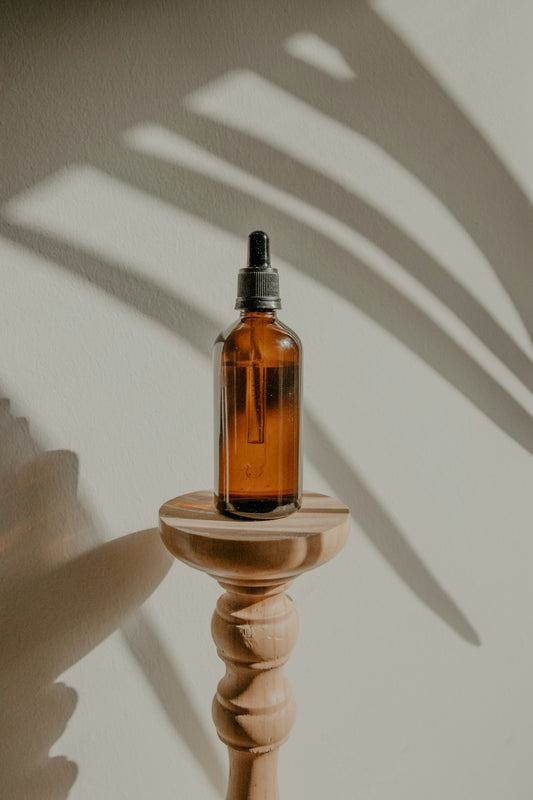 gold and black e cigarette on white round table